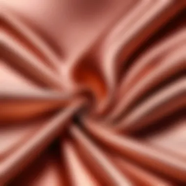 Textured Rose Gold Fabric Close-Up Close-up of rose gold fabric showcasing its texture and sheen